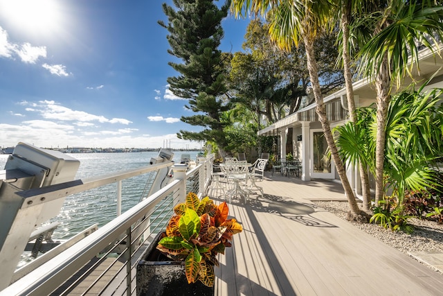 wooden deck featuring a water view