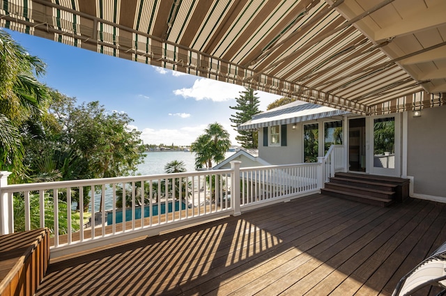 wooden terrace with a water view