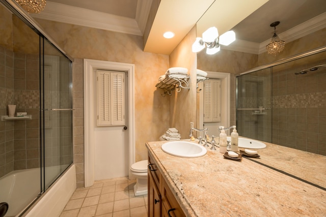 full bathroom featuring toilet, combined bath / shower with glass door, crown molding, vanity, and tile patterned flooring