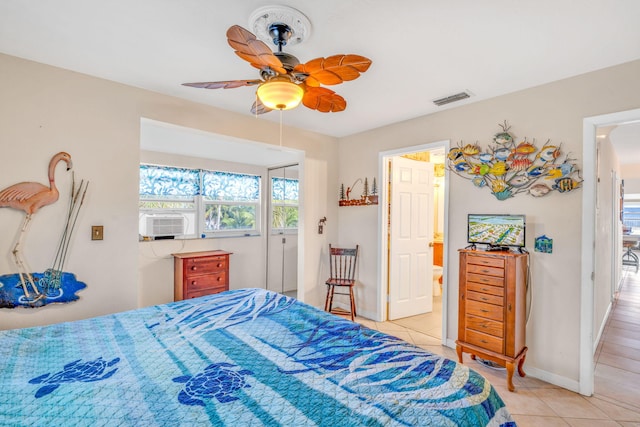 tiled bedroom featuring ceiling fan