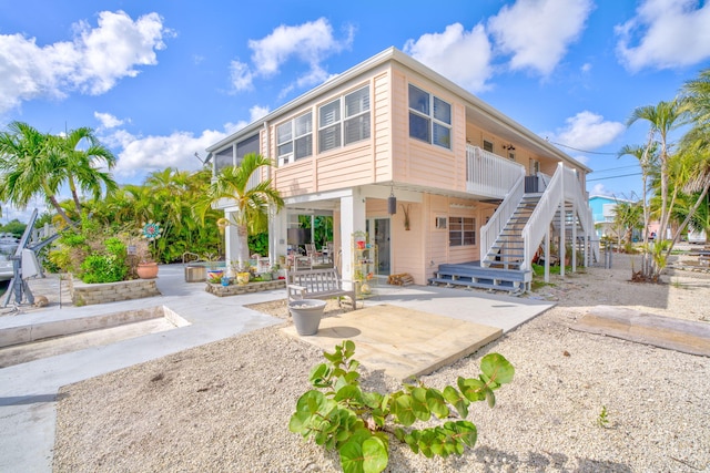 rear view of house featuring a patio