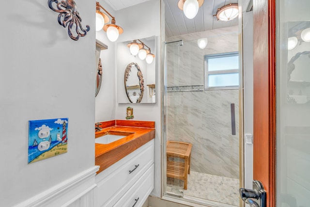 bathroom featuring vanity and an enclosed shower