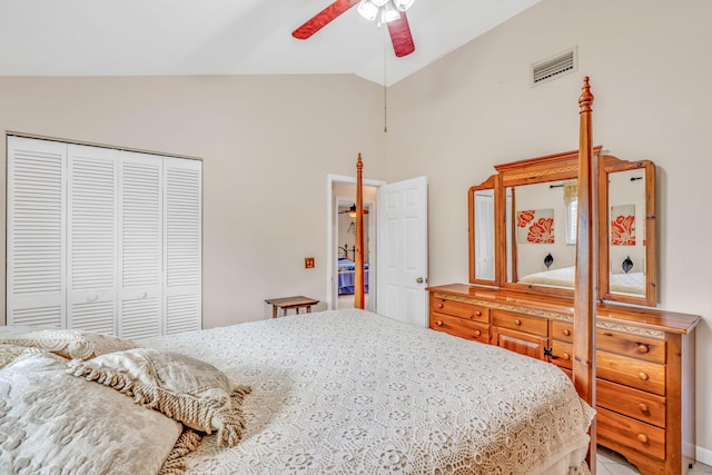 bedroom with lofted ceiling, a closet, and ceiling fan