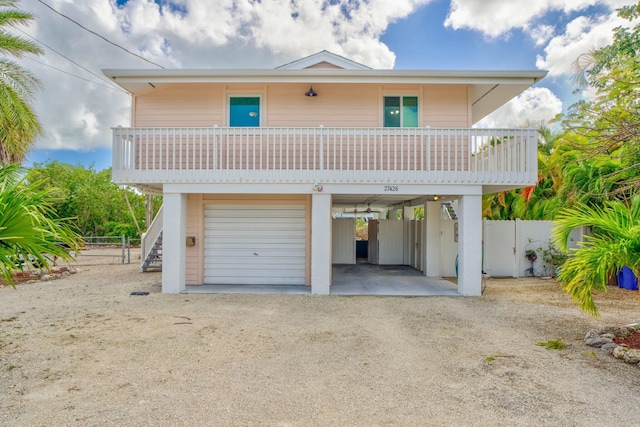 exterior space with a garage and a carport