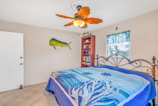 bedroom featuring ceiling fan and tile patterned flooring