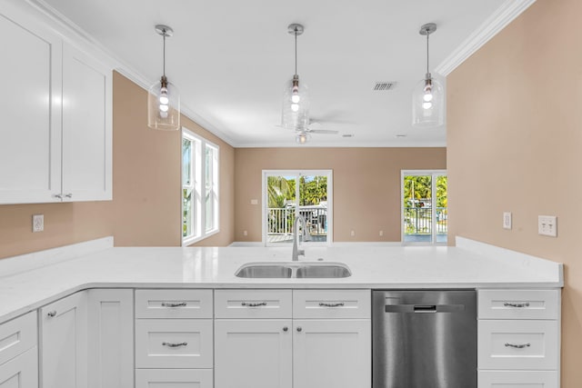 kitchen featuring ornamental molding, light countertops, stainless steel dishwasher, and a sink