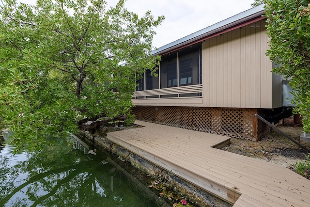 deck with a sunroom