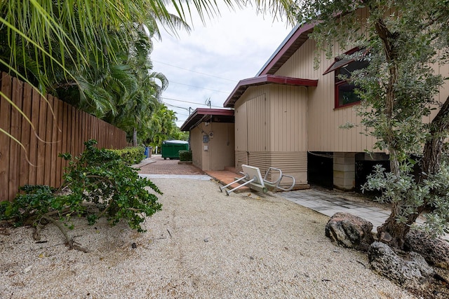 view of side of property with a patio