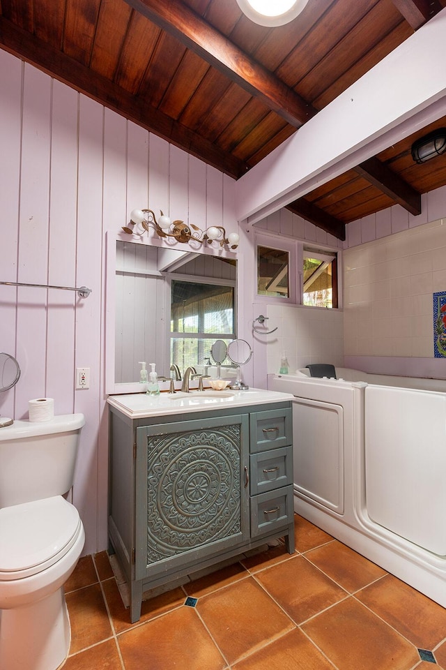 bathroom with tile patterned flooring, vanity, wood ceiling, toilet, and beam ceiling