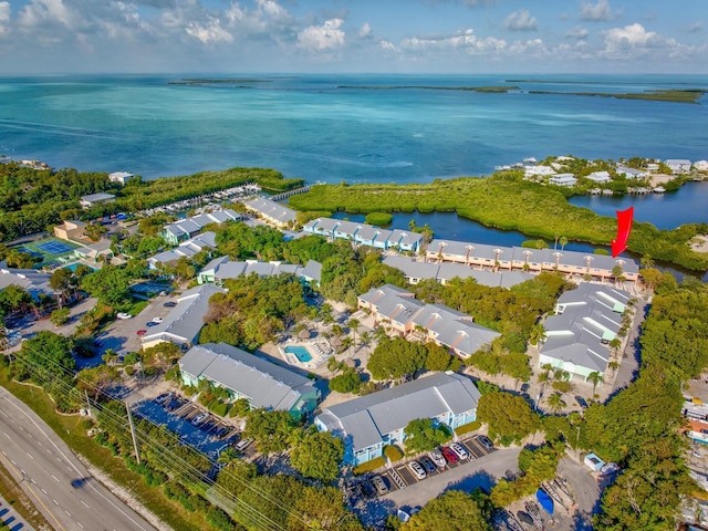 drone / aerial view with a water view and a residential view