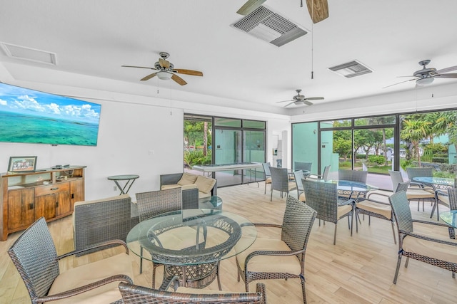 sunroom / solarium featuring a wealth of natural light and visible vents