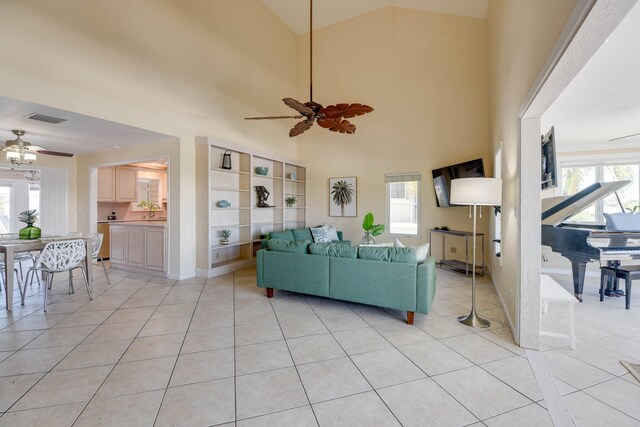 living room featuring light tile patterned flooring, ceiling fan, and high vaulted ceiling