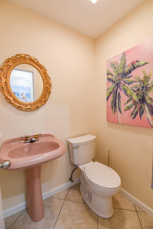 bathroom with tile patterned floors and toilet