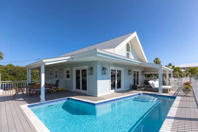 view of swimming pool featuring a wooden deck