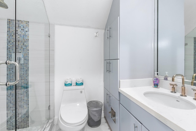 bathroom featuring a shower with door, vanity, and toilet