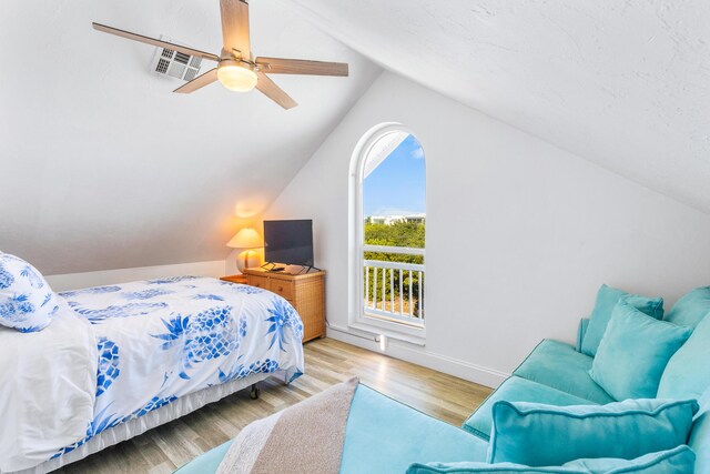 bedroom featuring vaulted ceiling, ceiling fan, and light hardwood / wood-style floors