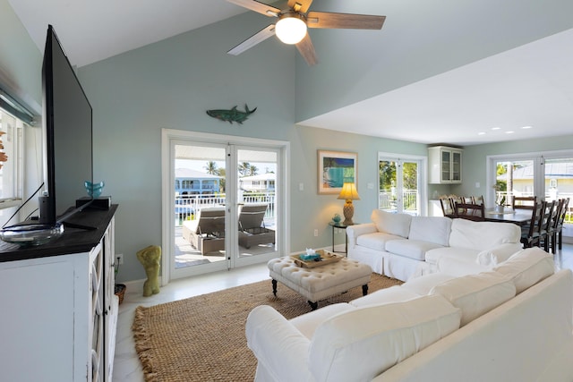 living room featuring high vaulted ceiling and ceiling fan