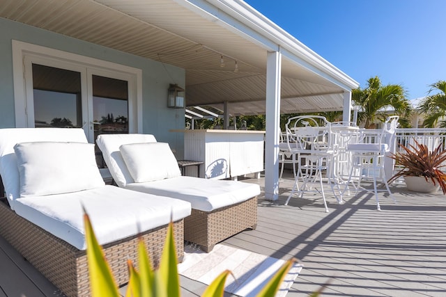 wooden deck with an outdoor hangout area