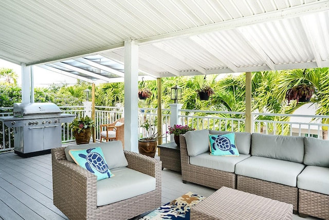 wooden deck featuring grilling area, outdoor lounge area, and a pergola