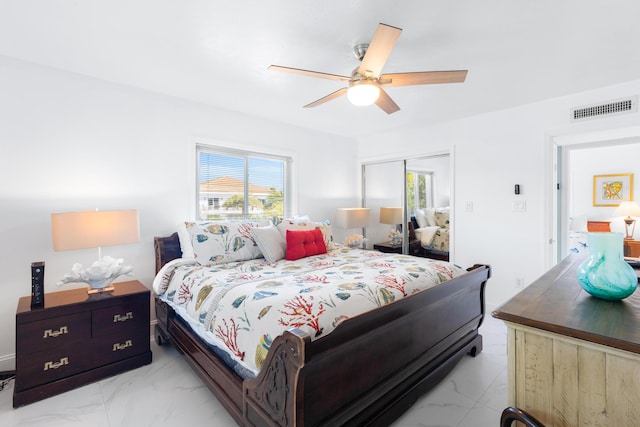 bedroom featuring ceiling fan and a closet