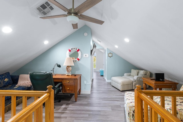 bedroom with vaulted ceiling, ceiling fan, and light hardwood / wood-style flooring