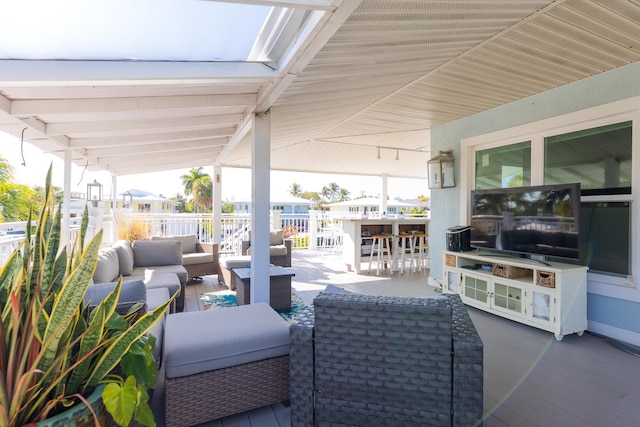 view of patio / terrace with exterior bar and an outdoor hangout area