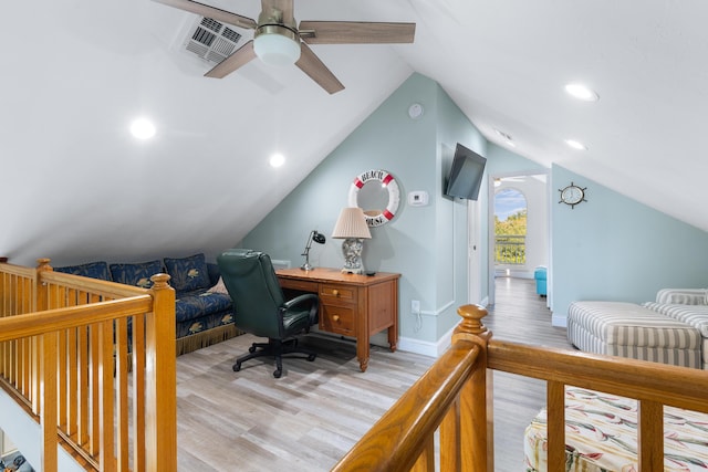 bedroom with ceiling fan, lofted ceiling, and light hardwood / wood-style flooring