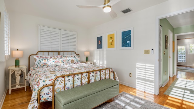 bedroom featuring ceiling fan and light hardwood / wood-style floors