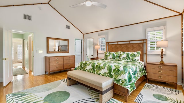 bedroom featuring ceiling fan, high vaulted ceiling, and light hardwood / wood-style flooring