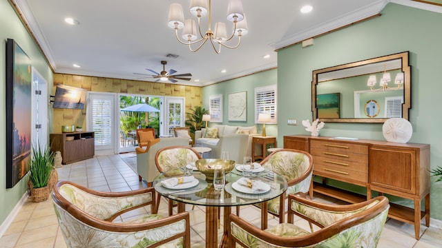 tiled dining area featuring ornamental molding and ceiling fan with notable chandelier