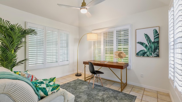 tiled home office featuring ceiling fan