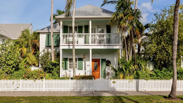 view of front of house featuring a balcony