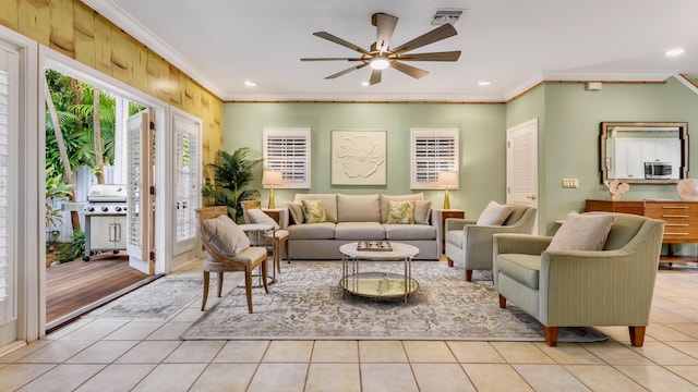 tiled living room featuring crown molding and ceiling fan