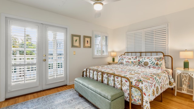 bedroom with access to exterior, wood-type flooring, and ceiling fan