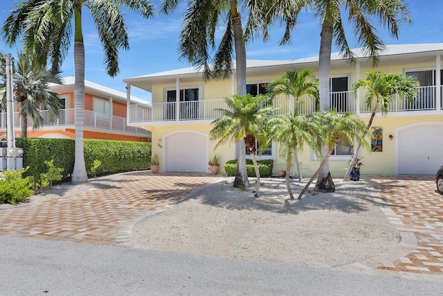 view of front of house with a balcony and a garage