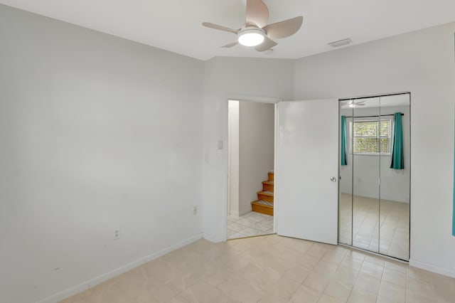462 Sunset Dr, Key Largo, FL 33037 - unfurnished bedroom featuring a closet, a ceiling fan, and baseboards