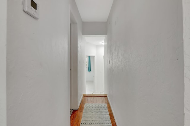 462 Sunset Dr, Key Largo, FL 33037 - hallway featuring wood finished floors