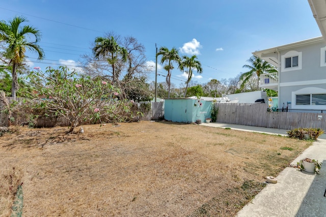 462 Sunset Dr, Key Largo, FL 33037 - fenced backyard featuring a shed and an outbuilding