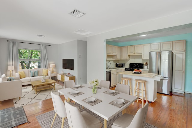 462 Sunset Dr, Key Largo, FL 33037 - dining room with light wood-style floors
