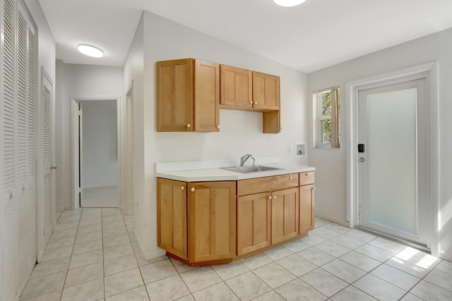 462 Sunset Dr, Key Largo, FL 33037 - kitchen featuring a sink, light tile patterned flooring, and light countertops