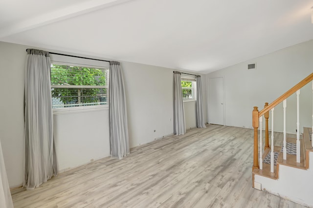 462 Sunset Dr, Key Largo, FL 33037 - unfurnished room with light wood finished floors, stairway, and lofted ceiling