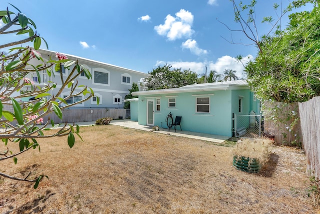 462 Sunset Dr, Key Largo, FL 33037 - back of house featuring fence, a patio, and stucco siding