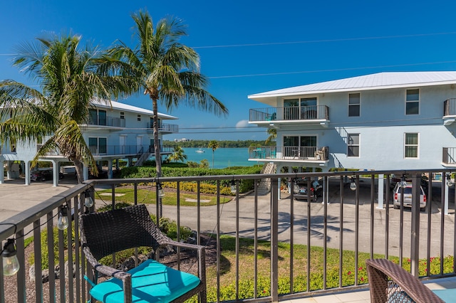 balcony featuring a water view