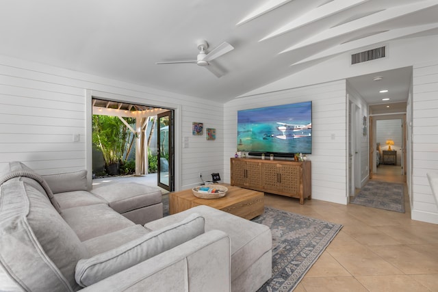 1511 S Street, Key West, FL 33040 - living room with wooden walls, lofted ceiling, light tile patterned floors, and ceiling fan