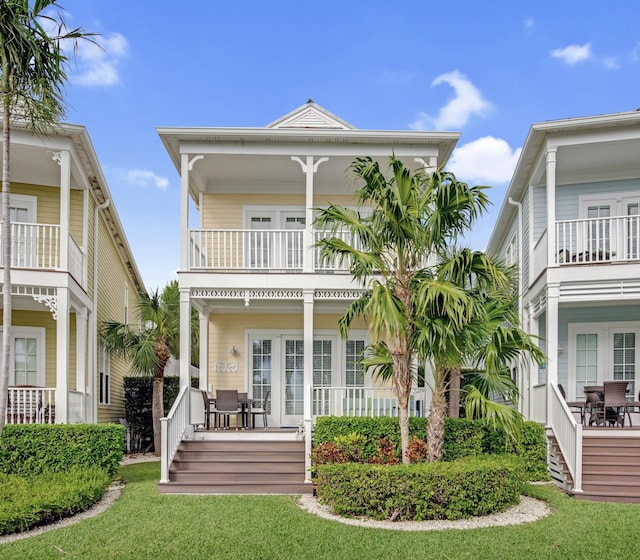144 Anglers Way, Islamorada, FL 33036 - view of front of house with a balcony, a porch, and french doors