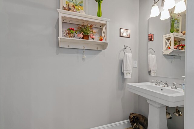 144 Anglers Way, Islamorada, FL 33036 - bathroom featuring baseboards and a sink
