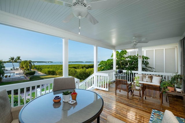 81250 Overseas Hwy Unit 2, Islamorada, FL 33036 - wooden deck with a ceiling fan, a water view, outdoor dining area, and outdoor lounge area