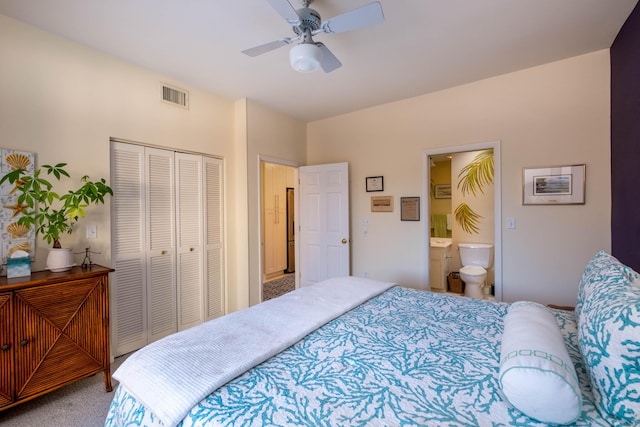 81250 Overseas Hwy Unit 2, Islamorada, FL 33036 - carpeted bedroom featuring a closet, ceiling fan, and ensuite bathroom