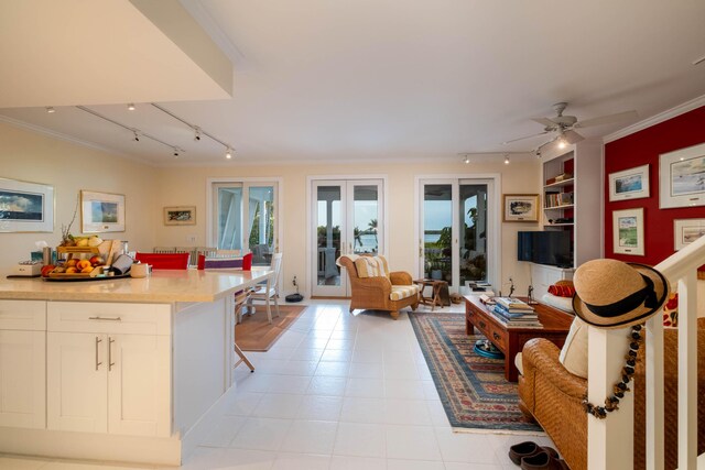 81250 Overseas Hwy Unit 2, Islamorada, FL 33036 - living room featuring track lighting, ornamental molding, plenty of natural light, a ceiling fan, and built in features