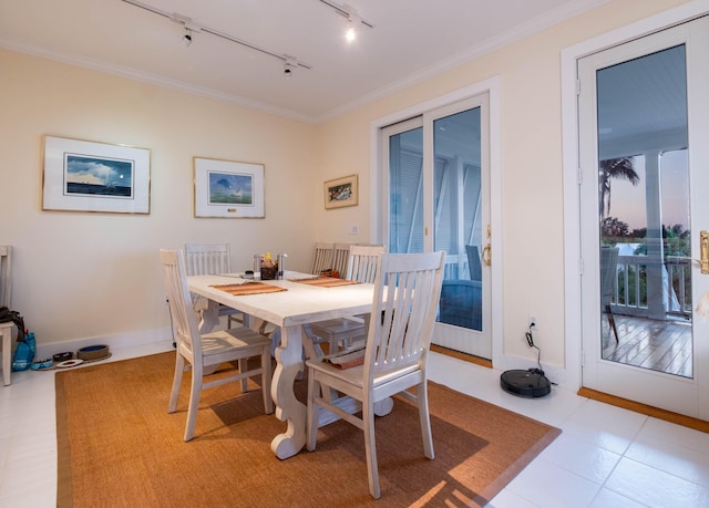 81250 Overseas Hwy Unit 2, Islamorada, FL 33036 - dining room featuring rail lighting, ornamental molding, baseboards, and light tile patterned floors